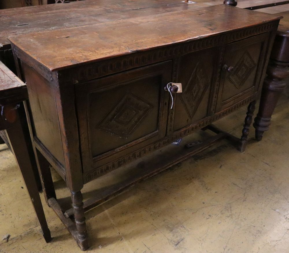 A Tudor style carved oak sideboard, width 119cm depth 36cm height 80cm